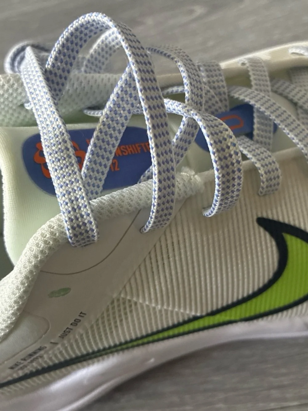 Nike Kids White Sneakers with Neon Lime Swoosh and Blue-White Laces